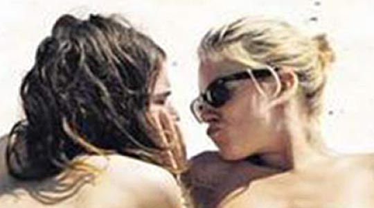 Sienna Miller sunbathing topless